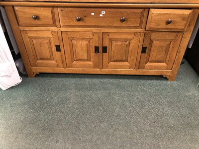 Lot 22 - A modern oak side board with three drawers...