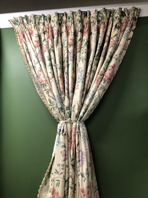 Lot 23 - Four floral chintz interlined curtains...