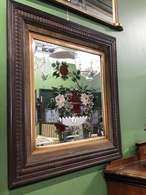 Lot 35 - An engraved and reverse painted mirror...