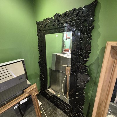 Lot 53 - A bevelled glass rectangular mirror within a...