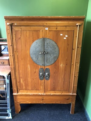 Lot 60 - A Chinese pine cupboard, the doors enclosing...