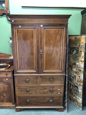 Lot 67 - A satin wood banded linen press, the doors...