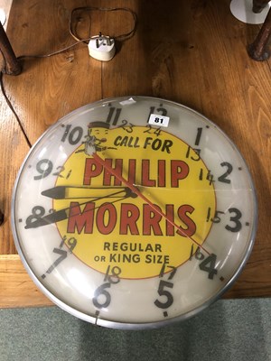 Lot 81 - An electric wall clock advertising Philip...