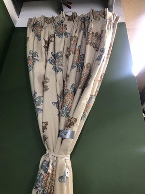 Lot 83 - A pair of beige ground interlined curtains...