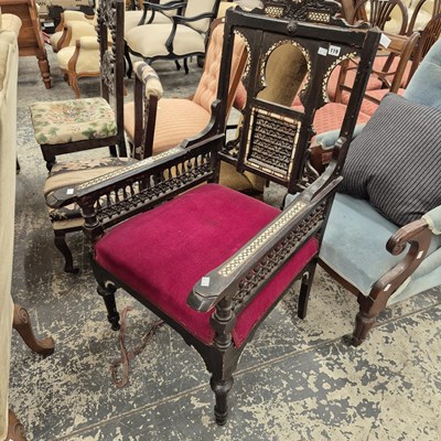 Lot 119 - A carved and inlaid antique armchair in the...