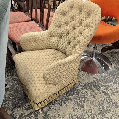Lot 121 - A Victorian button back armchair.
