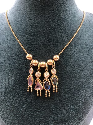 Lot 627 - A group of four gemset birthstone figure...