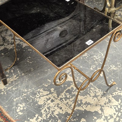 Lot 316 - A glass topped coffee table.