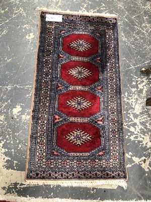 Lot 1657 - An Oriental mat. 49 x 96 cm.