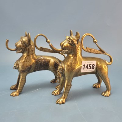 Lot 1458 - Two polished bronze lion aquamanile oil lamps,...