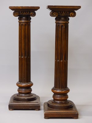 Lot 1464 - A pair of mahogany ionic stop fluted columnar...