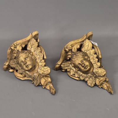Lot 1476 - A pair of 19th-century gilt wood winged angel...