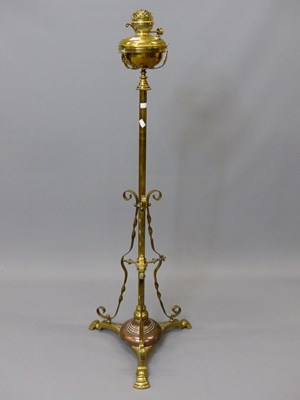 Lot 1479 - A brass floor standing oil lamp converted to...