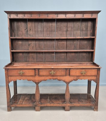 Lot 1566 - A 19th century oak dresser, the enclosed shelf...