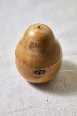 Lot 214 - An antique Georgian fruitwood pear form tea...