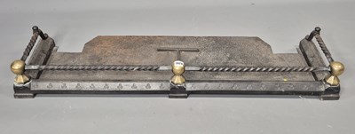 Lot 1624 - A Victorian iron fender, the spiral top rail...