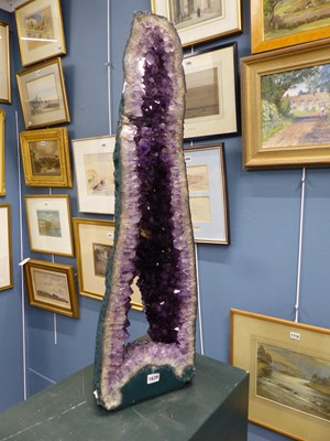 Lot 1639 - An amethyst geode. W26cms H 89cms