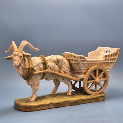 Lot 1640 - A Royal Dux figure of a goat hauling a two...