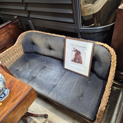 Lot 47 - A good quality rattan conservatory settee.