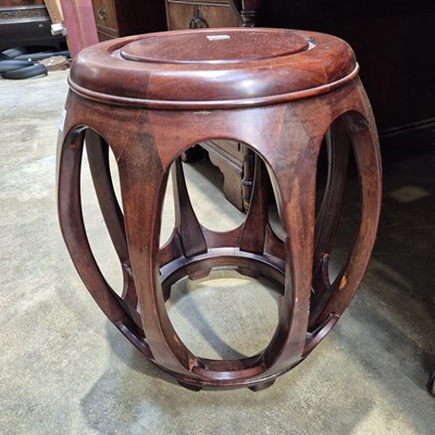 Lot 81 - An oriental hardwood urn stand.