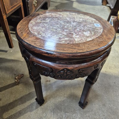 Lot 137 - An oriental hardwood urn stand with marble...