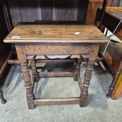 Lot 169 - An oak joint stool and a yew wood coffee table.