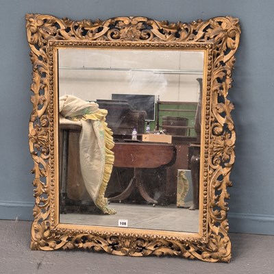 Lot 108 - An antique Florentine carved giltwood mirror....