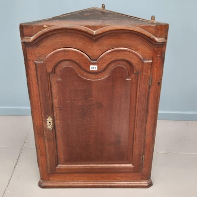 Lot 341 - A Georgian carved oak country made hanging...