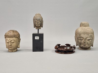 Lot 312 - A group of three Oriental deity heads, two in...