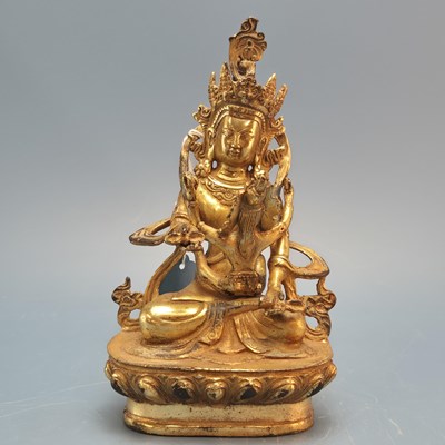 Lot 348 - A Tibetan gilt bronze figure of a deity. H 18cms