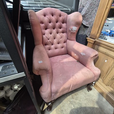 Lot 278 - A Georgian style wingback button armchair. H...