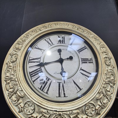Lot 300 - A large decorative wall clock. D 70cms