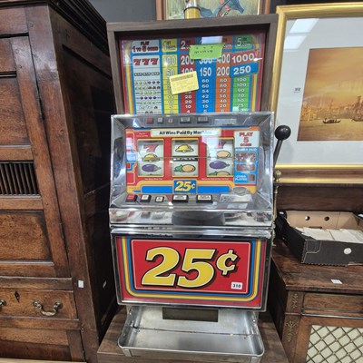 Lot 310 - A vintage one arm bandit gaming machine.