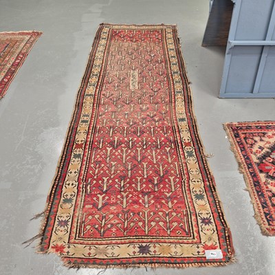 Lot 1758 - An antique tribal Caucasian runner, 316 x 109cms