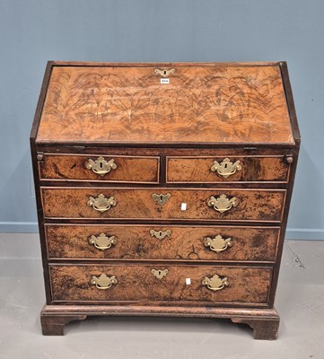 Lot 454 - An early Georgian inlaid walnut slant top...