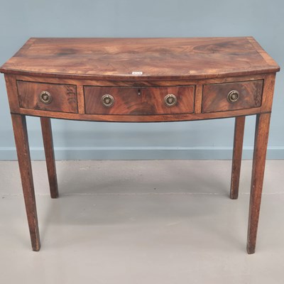 Lot 659 - A late Georgian mahogany and cross banded bow...