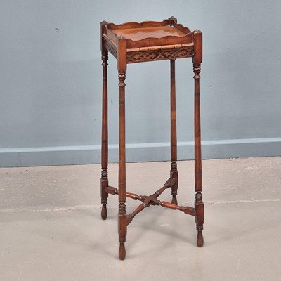 Lot 675 - A Georgian style mahogany kettle stand with...