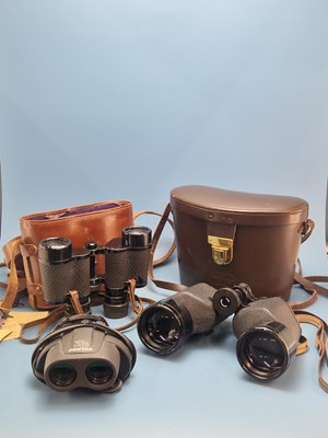 Lot 959 - Two leather cased pairs of binoculars, a...