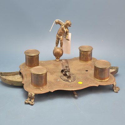 Lot 537 - An antique copper and brass standish, etched...