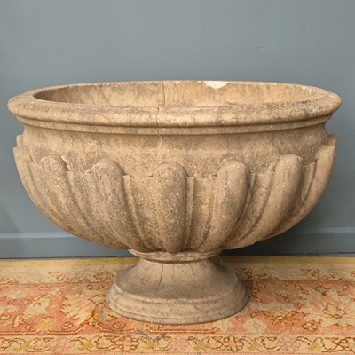 Lot 489 - An early carved marble oval cistern, ribbed...