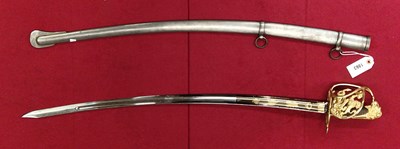 Lot 1863 - A sabre with an iron scabbard, the gilt guard...
