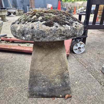Lot 1119 - A staddle stone and cap. H 66 D 53cms