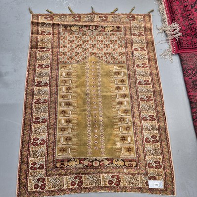 Lot 595 - An antique Ghiordes, Turkish prayer rug.