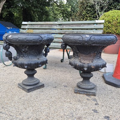 Lot 1138 - A Pair of antique cast iron garden urns.H 65cm,...