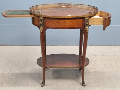 Lot 324 - A European two tier table, the brass galleried...