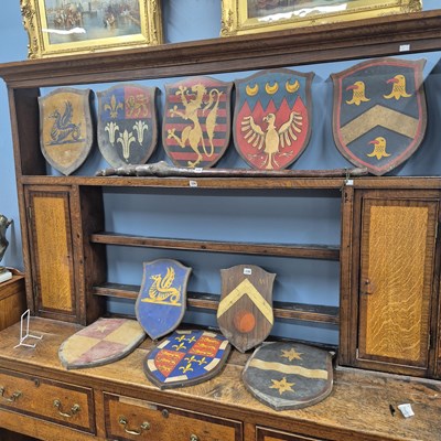 Lot 336 - Ten painted wooden armorial shields. H 43cms.
