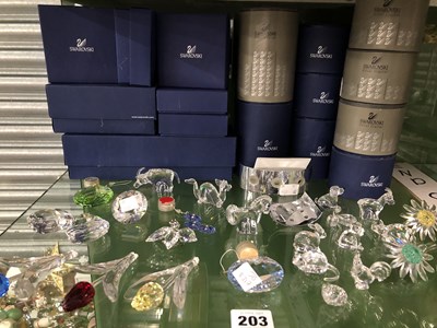 Lot 203 - A collection of boxed Swarovski glass animals...