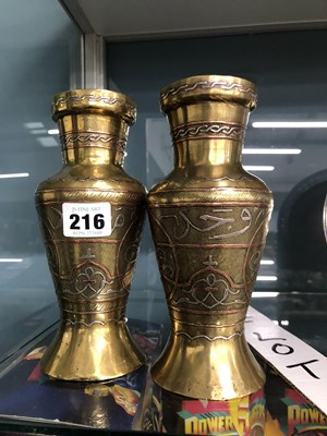 Lot 216 - A pair of brass Cairo ware vases damascened in...