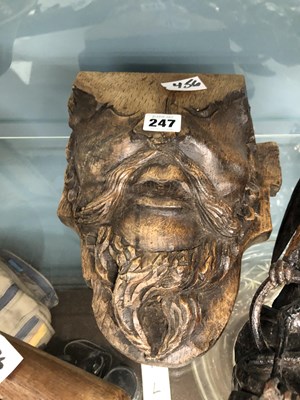 Lot 247 - Two carved oak masks, other treen, a truncheon...