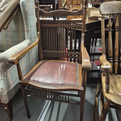 Lot 819 - An arts and crafts style armchair.